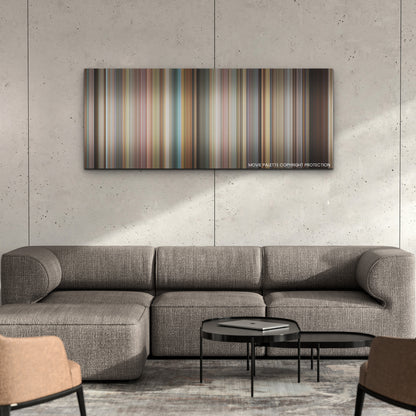 Do Revenge color palette canvas on a concrete wall above a gray sectional sofa