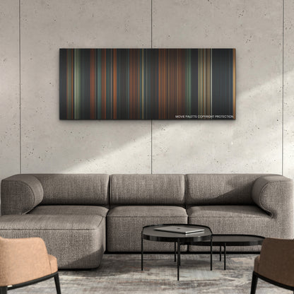 The Watchers color palette canvas on a concrete wall above a gray sectional sofa