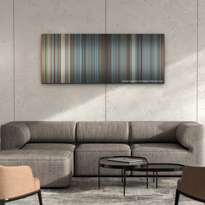Tetris color palette canvas on a concrete wall above a gray sectional sofa