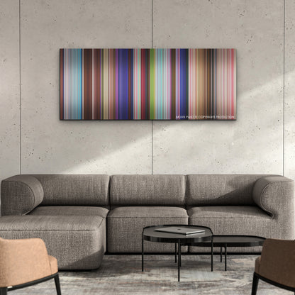 The Sea Beast color palette canvas on a concrete wall above a gray sectional sofa