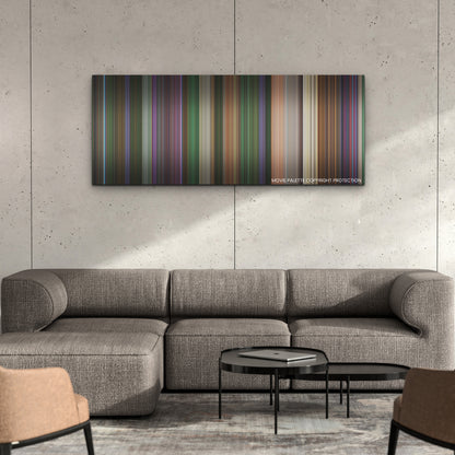 Renfield color palette canvas on a concrete wall above a gray sectional sofa