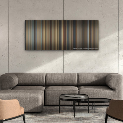 Gladiator II color palette canvas on a concrete wall above a gray sectional sofa