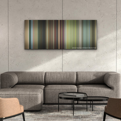 Brothers color palette canvas on a concrete wall above a gray sectional sofa