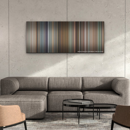 Upgraded color palette canvas on a concrete wall above a gray sectional sofa