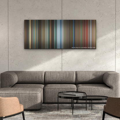 Black Widow color palette canvas on a concrete wall above a gray sectional sofa
