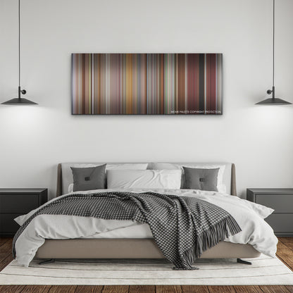 CODA color palette canvas above a bed, between two black pendant lamps