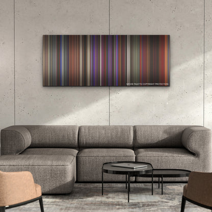 Last Night in Soho color palette canvas on a concrete wall above a gray sectional sofa