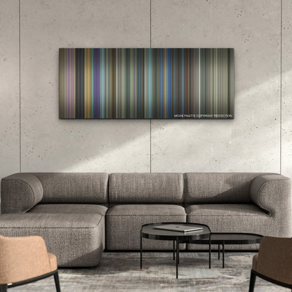 The Beekeeper color palette canvas on a concrete wall above a gray sectional sofa