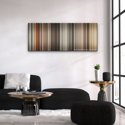 Furiosa: A Mad Max Saga color palette canvas above a black sofa with a gold-topped table