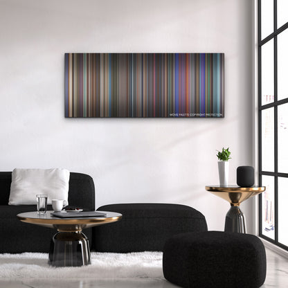 Elvis color palette canvas above a black sofa with a gold-topped table