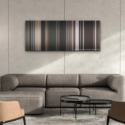 Pearl color palette canvas on a concrete wall above a gray sectional sofa