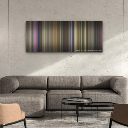 The Idea of You color palette canvas on a concrete wall above a gray sectional sofa