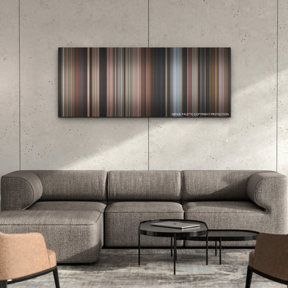 The Woman King color palette canvas on a concrete wall above a gray sectional sofa