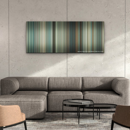 Twisters color palette canvas on a concrete wall above a gray sectional sofa