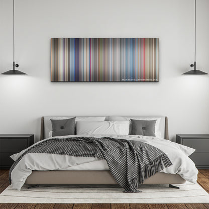 Lift color palette canvas above a bed, between two black pendant lamps