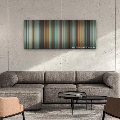 Challengers color palette canvas on a concrete wall above a gray sectional sofa