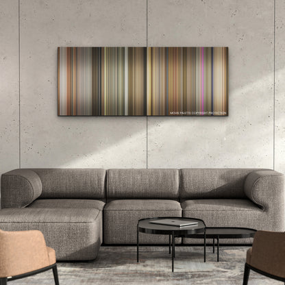 Argylle color palette canvas on a concrete wall above a gray sectional sofa