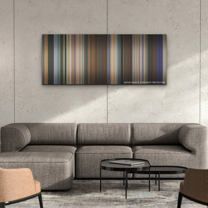 Totally Killer color palette canvas on a concrete wall above a gray sectional sofa