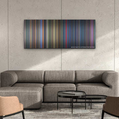 Lightyear color palette canvas on a concrete wall above a gray sectional sofa