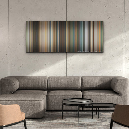 Fast X color palette canvas on a concrete wall above a gray sectional sofa
