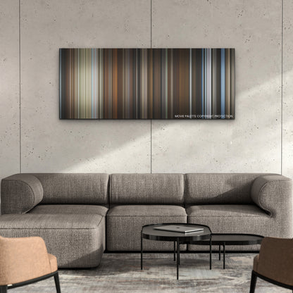 The Hand of God color palette canvas on a concrete wall above a gray sectional sofa