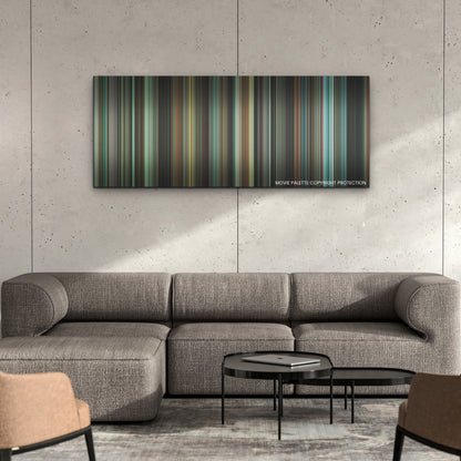 The Many Saints of Newark color palette canvas on a concrete wall above a gray sectional sofa