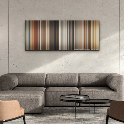Furiosa: A Mad Max Saga color palette canvas on a concrete wall above a gray sectional sofa