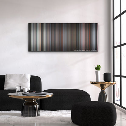 The Lost Daughter color palette canvas above a black sofa with a gold-topped table