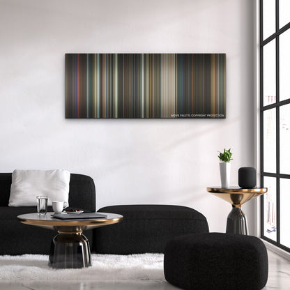 The Gray Man color palette canvas above a black sofa with a gold-topped table