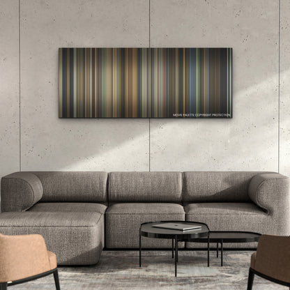 Cruella color palette canvas on a concrete wall above a gray sectional sofa