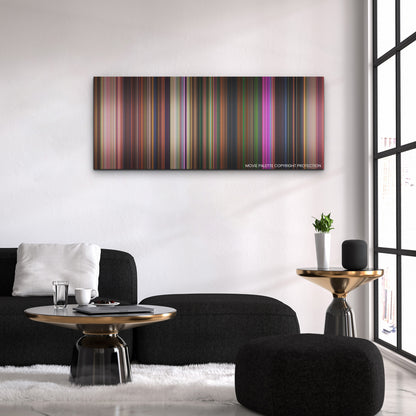 Encanto color palette canvas above a black sofa with a gold-topped table