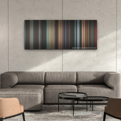 All of Us Strangers color palette canvas on a concrete wall above a gray sectional sofa