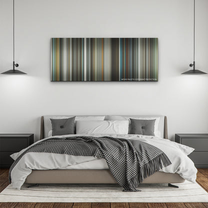 Spiderhead color palette canvas above a bed, between two black pendant lamps