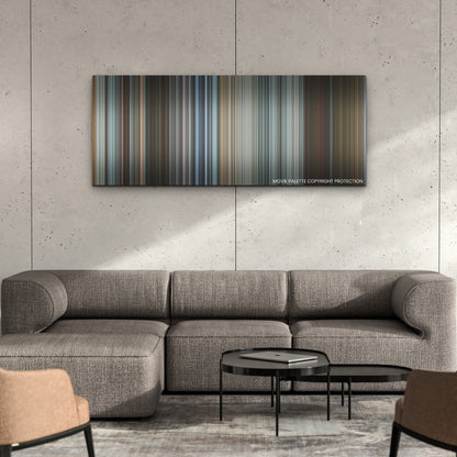 Extraction II color palette canvas on a concrete wall above a gray sectional sofa