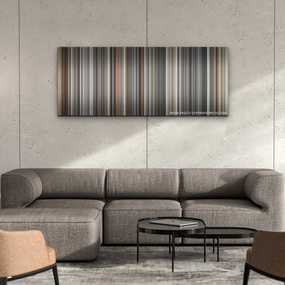 Blonde color palette canvas on a concrete wall above a gray sectional sofa