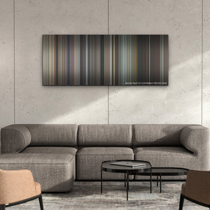 May December color palette canvas on a concrete wall above a gray sectional sofa