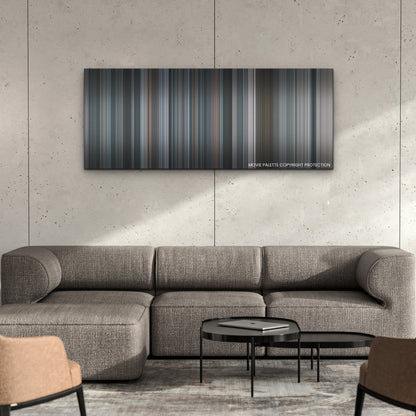 The Good Nurse color palette canvas on a concrete wall above a gray sectional sofa