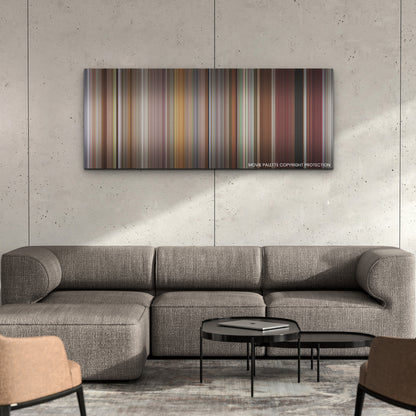 CODA color palette canvas on a concrete wall above a gray sectional sofa