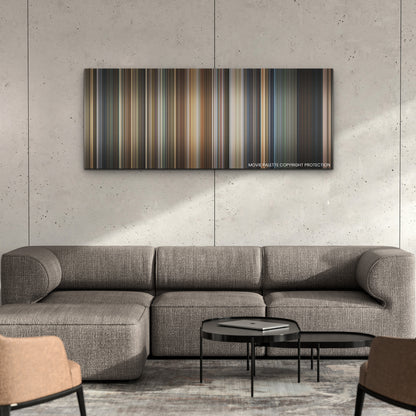 Sound of Freedom color palette canvas on a concrete wall above a gray sectional sofa
