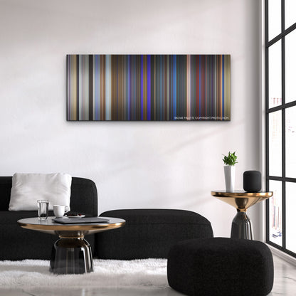 Blue Beetle color palette canvas above a black sofa with a gold-topped table
