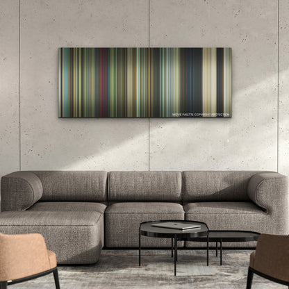 Dog color palette canvas on a concrete wall above a gray sectional sofa