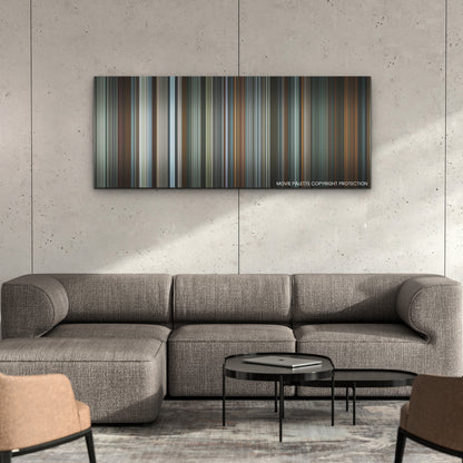 Absolution color palette canvas on a concrete wall above a gray sectional sofa