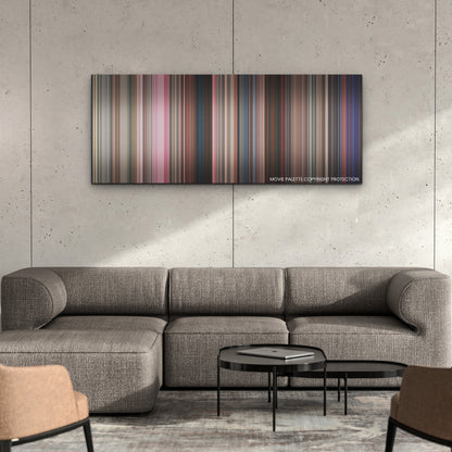 Mean Girls color palette canvas on a concrete wall above a gray sectional sofa