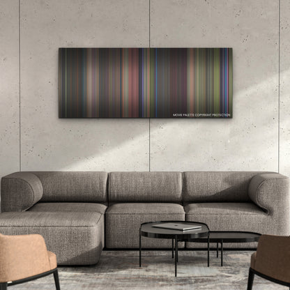 Lisa Frankenstein color palette canvas on a concrete wall above a gray sectional sofa