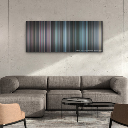 The Fix color palette canvas on a concrete wall above a gray sectional sofa