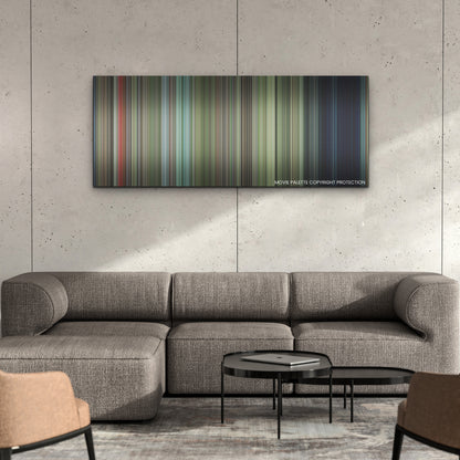 Cocaine Bear color palette canvas on a concrete wall above a gray sectional sofa