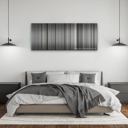 Belfast color palette canvas above a bed, between two black pendant lamps