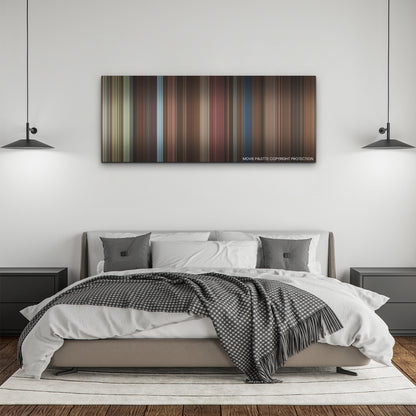 Love Hard color palette canvas above a bed, between two black pendant lamps