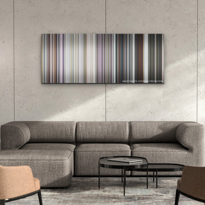 Missing color palette canvas on a concrete wall above a gray sectional sofa