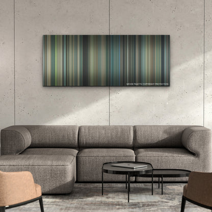 Air color palette canvas on a concrete wall above a gray sectional sofa